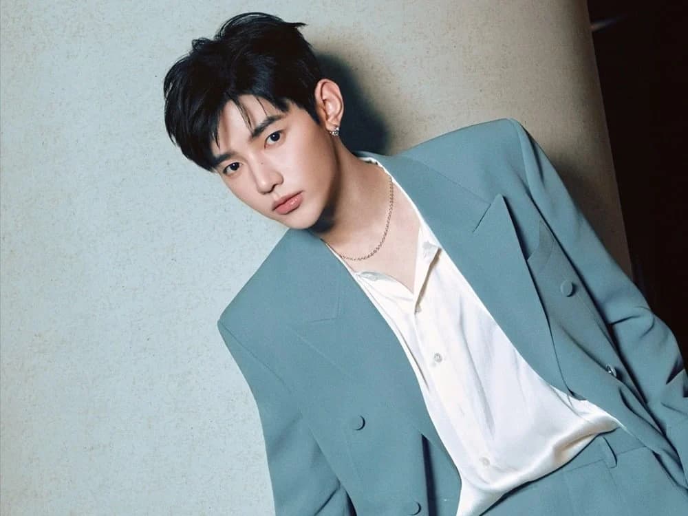 AND2BLE's Zhang Hao Trades Bright Zerobaseone Image for Jade Suit in Billboard Korea Cover